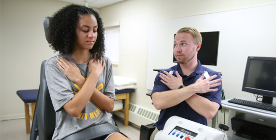Student conducting physical therapy