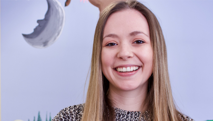 Student smiling at the camera