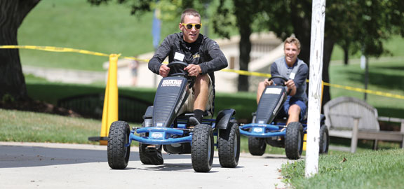 students driving go-karts