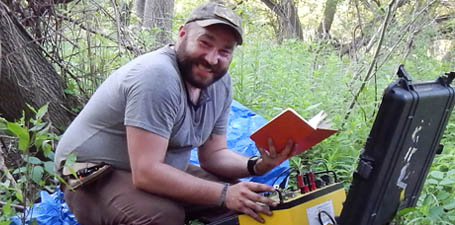 Brian Samsen conducting research in the field