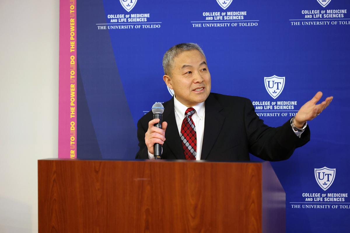 Dr. Jian-Ting Zhang, director of the Northwest Ohio Cancer Research Institute, speaks at a podium during the institute’s inauguration ceremony at The University of Toledo.