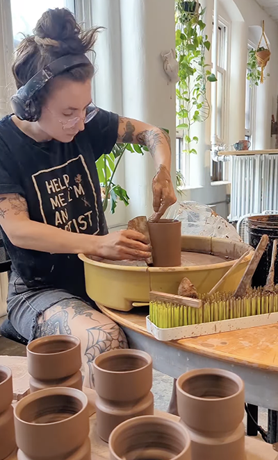 2017 UToledo Art alumna Kayla Kirk at her pottery wheel