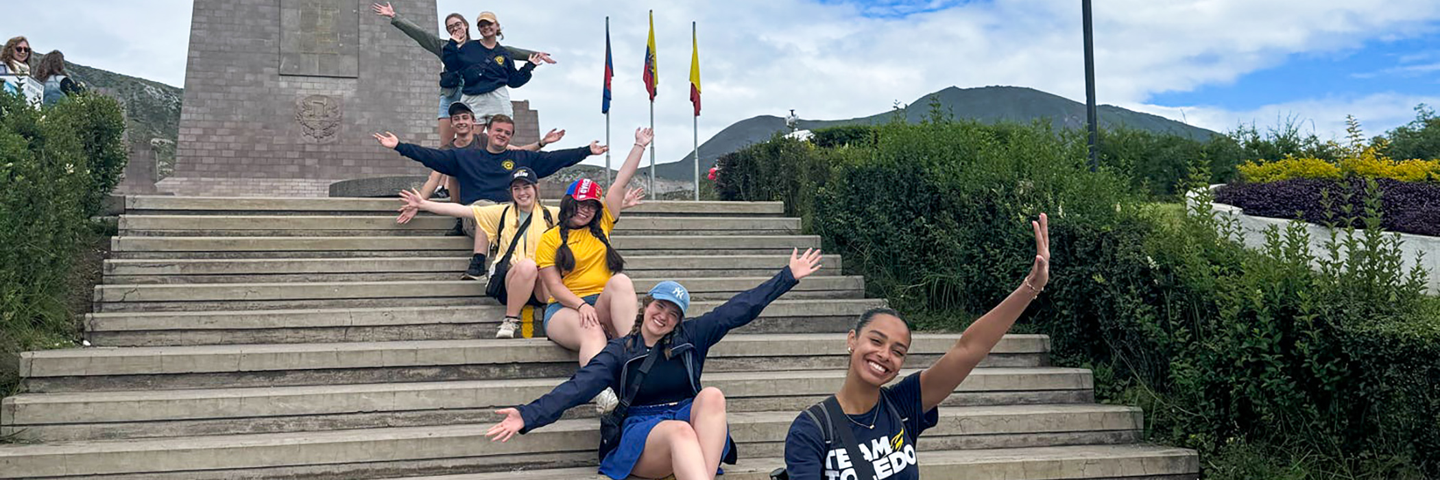 A group of students sitting on stairs