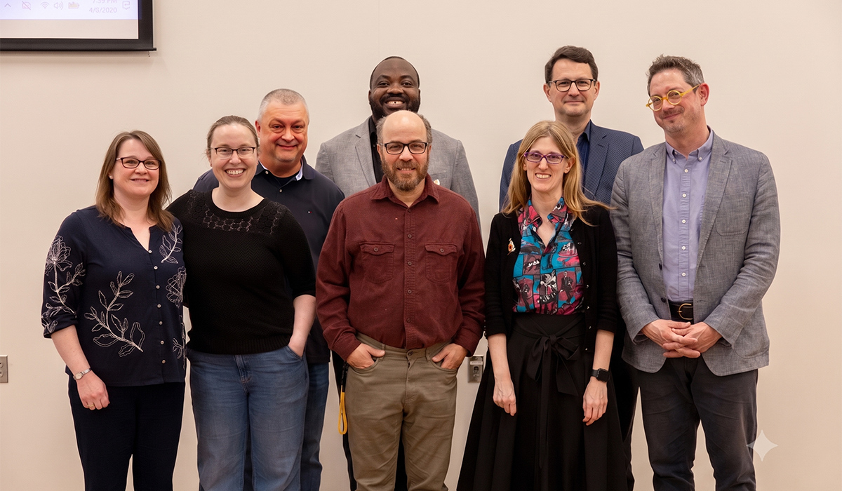 Department of history standing together to take a group photo