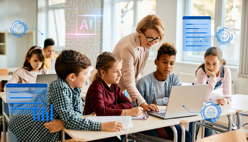A teacher showing students digital technology on a laptop