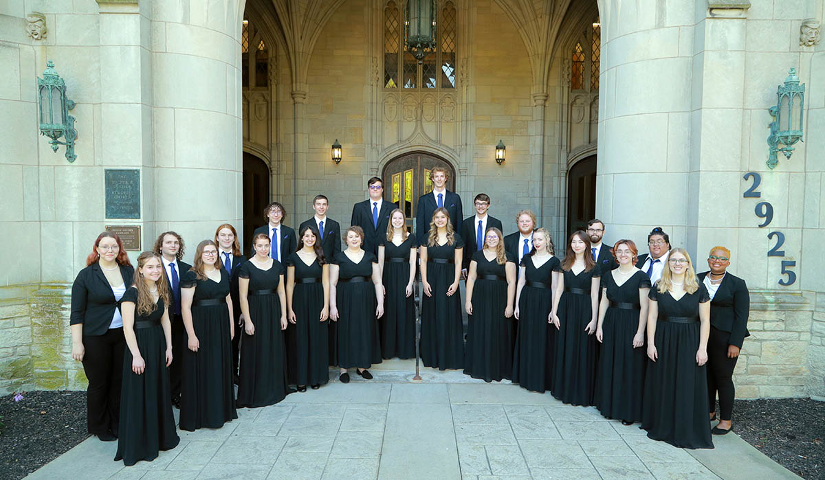 choral singers in front of University Hall