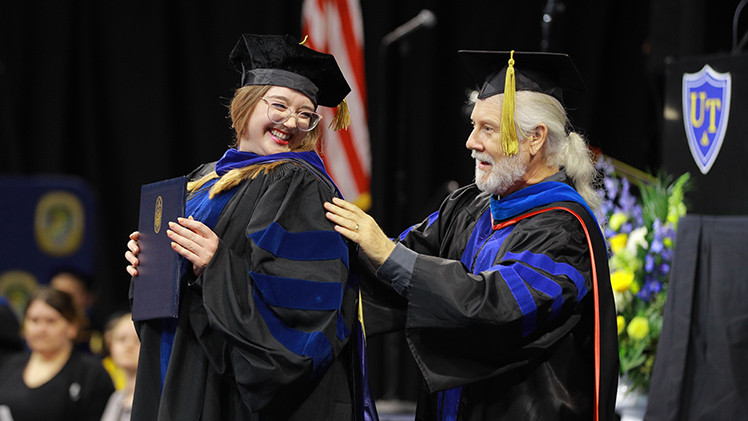 Doctoral student being hooded