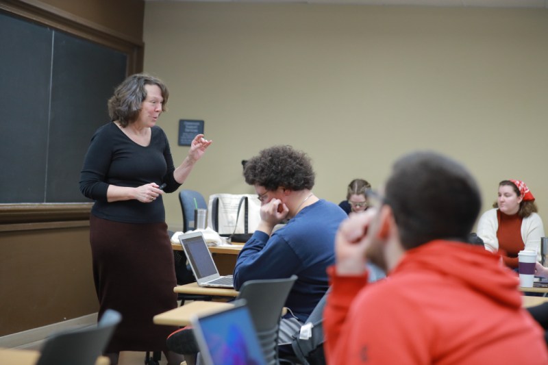 Photo of a professor teaching in front of a class