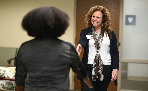 Employee greeting a guest