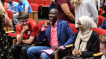 students smiling in group conversation