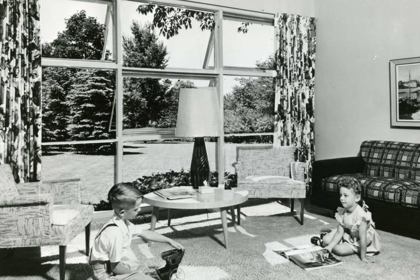 House Home Exhibit Children sitting in 1950s living room