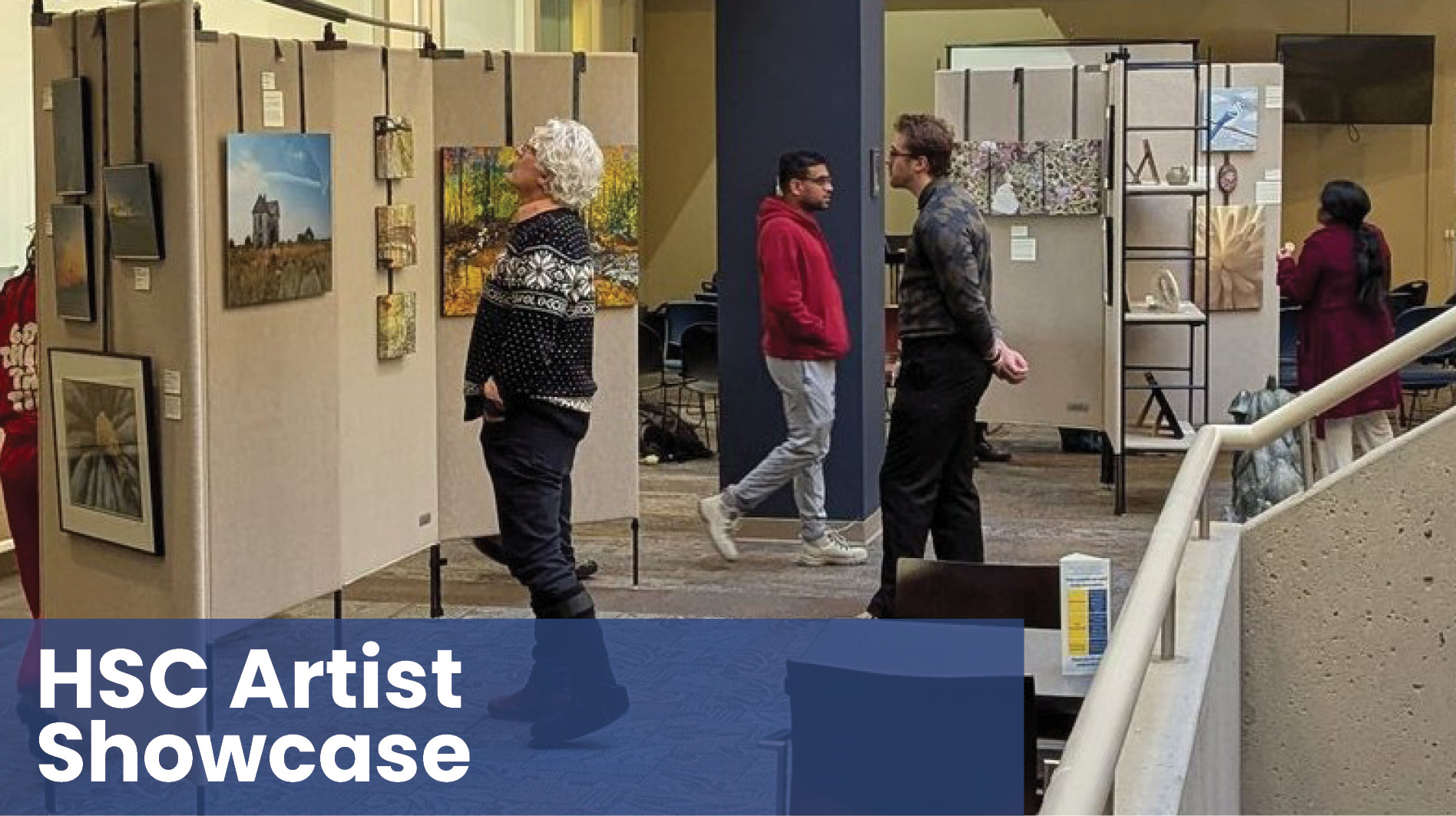 HSC Artist Showcase with people viewing art in background