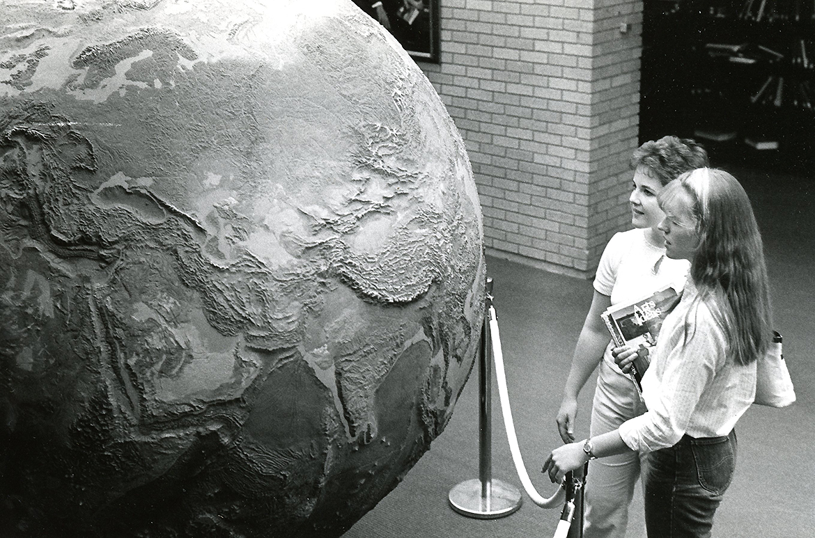 Students viewing the geophysical globe