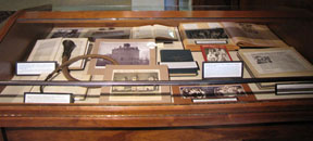 Flat case displaying exhibits related to blind and deaf persons, left side