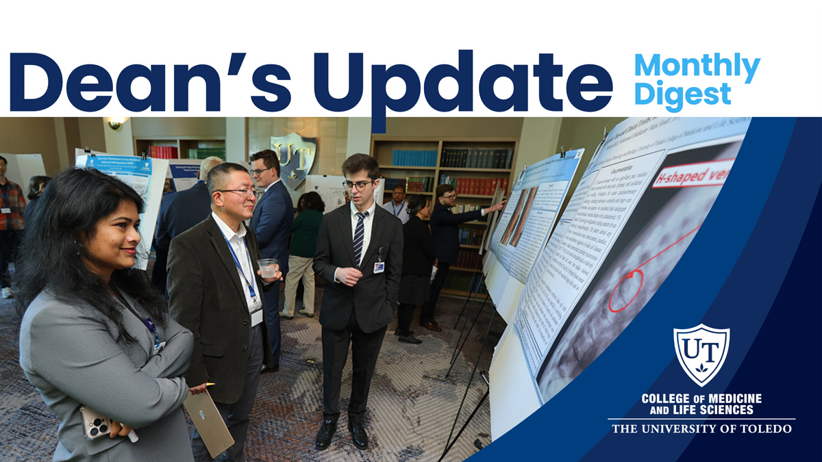 Dean’s Update: Monthly Digest header featuring a photo from the Toledo Cancer Research Symposium. Faculty members, researchers and students stand among poster presentations, discussing research findings during the symposium. The newsletter title appears across the top with the UToledo College of Medicine and Life Sciences logo on a blue graphic overlay at right.