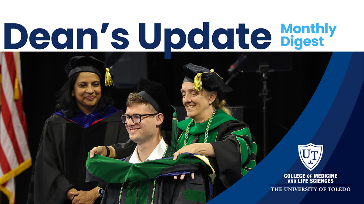 Dean’s Update: Monthly Digest header featuring a commencement photo of a medical graduate being hooded on stage by faculty members during the ceremony. The newsletter title appears across the top with the UToledo College of Medicine and Life Sciences logo on a blue graphic overlay at right.