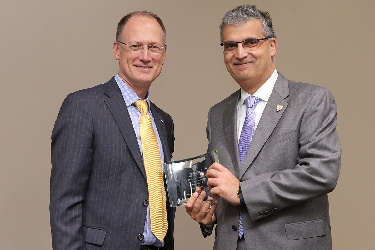 Imran Ali, M.D., with Dean Christopher J. Cooper, M.D.