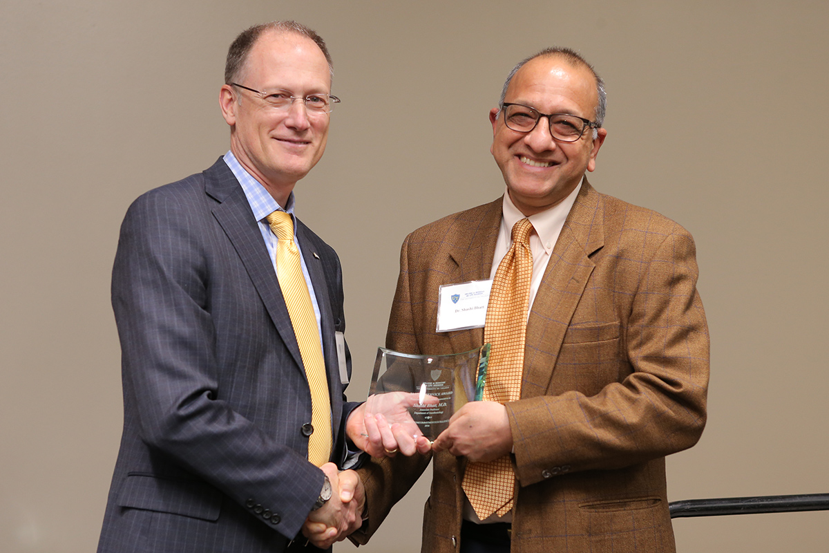 Shashi Bhatt, M.D., with Dean Christopher J. Cooper, M.D.