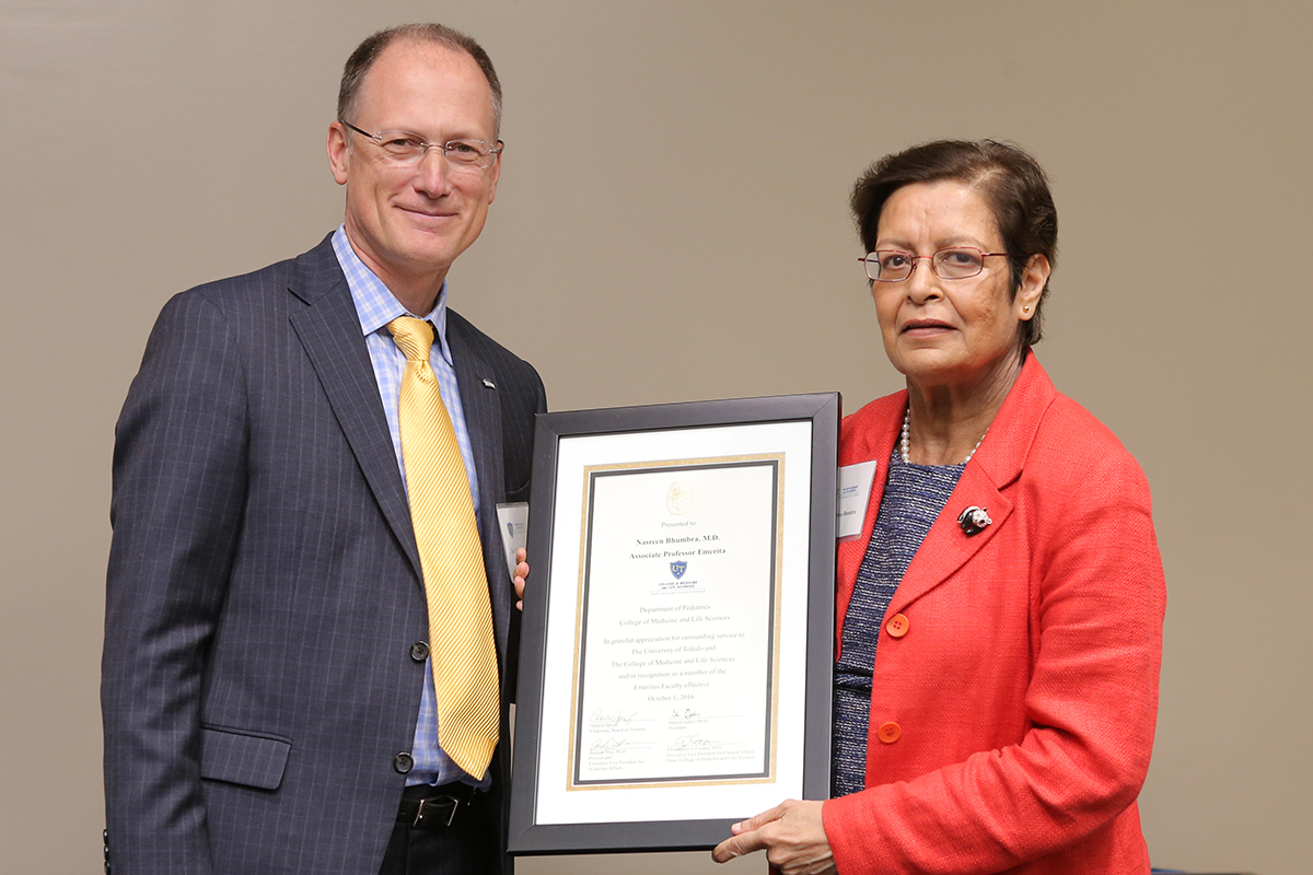 Nasreen Bhumbra, M.D., with Dean Christopher J. Cooper, M.D.