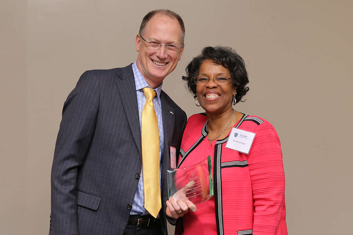 Patricia Hogue, M.D., with Dean Christopher J. Cooper, M.D.