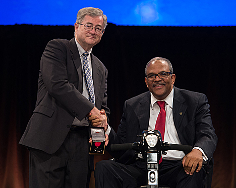 Dr. Baugh accepts an award.