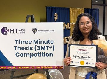 Photo of Rejina Shrestha with UToledo 3MT first place recognition