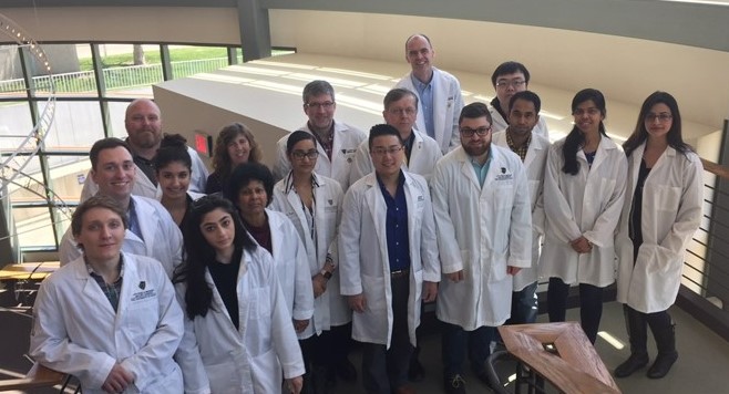 Group photo of students with researchers.