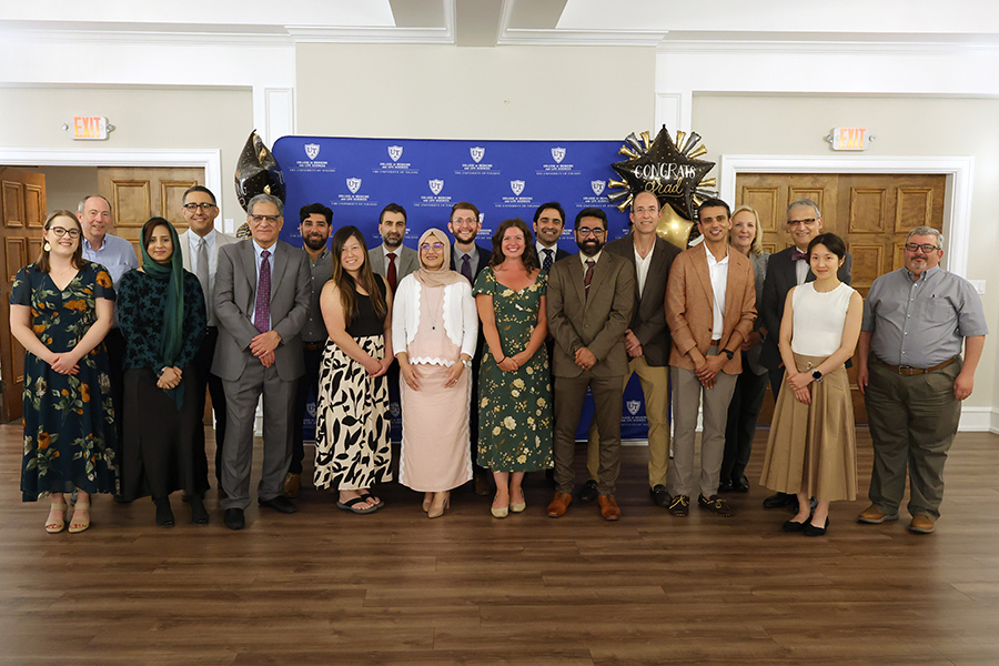 Faculty with residents at graduation.