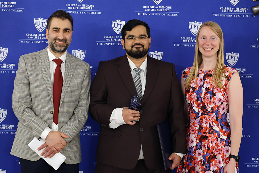 Graduating fellow with coordinator and attending
