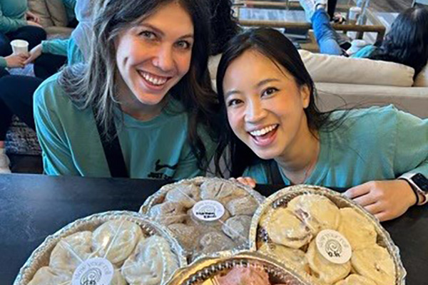 Camille and Katherine with cinnamon rolls.