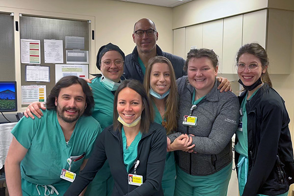 Group photo with Dr. Brodsky and Dr. Lafyatis in clinical setting.