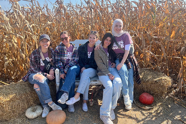 Kristi, Kassidy, Laura, Alex, and Hala at a pumpkin patch