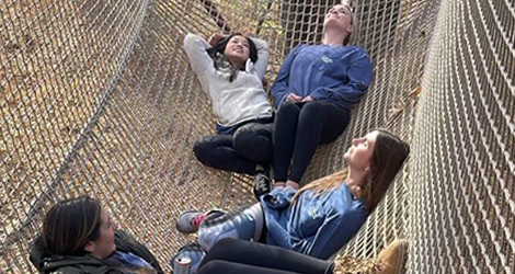 Resident laying in the bridge hammock on retreat