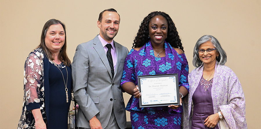 A group photo of Pediatric leadership during an awards presentation.