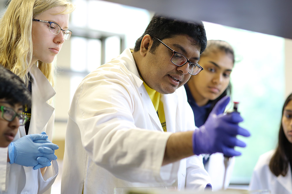 Students in a lab at Pre-Med Summer Camp