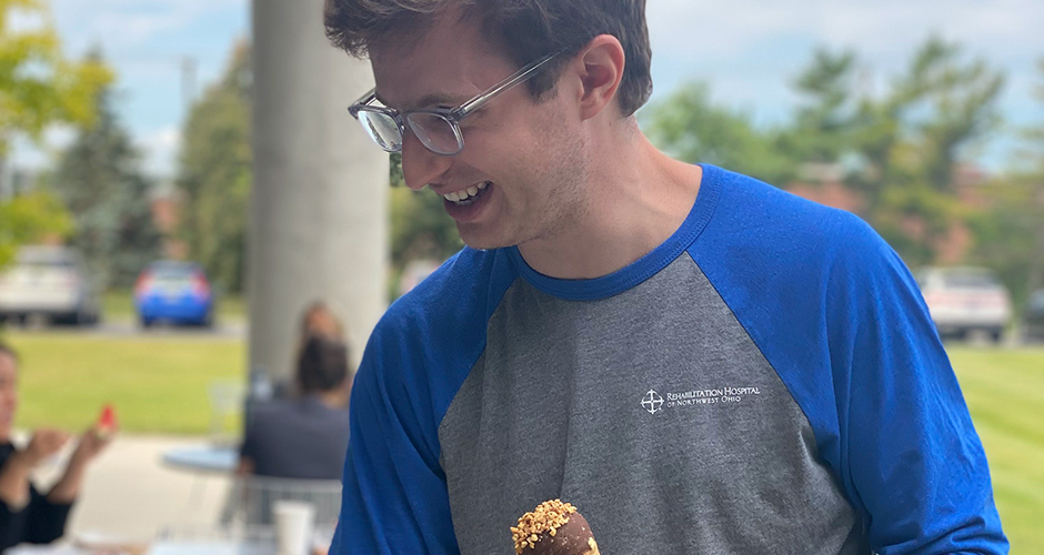 Resident eating ice cream at a social event.