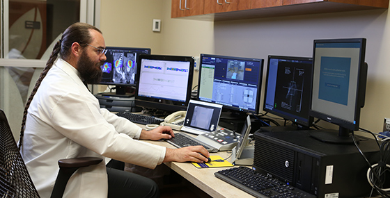 male at computer in lab