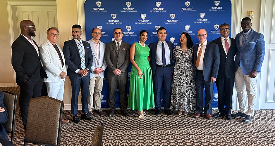 Residents take a group photo following graduation