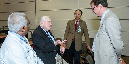 Keynote speaker Dr. Matthias Kretzler is pictured at the symposium with Dr. Rujun Gong, Vice Chair of Research; Dr. Lance Dworkin; and Dr. Basil Akpunonu, Department Chair.