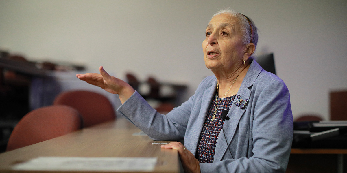 Dr. Gohara standing in a classroom.