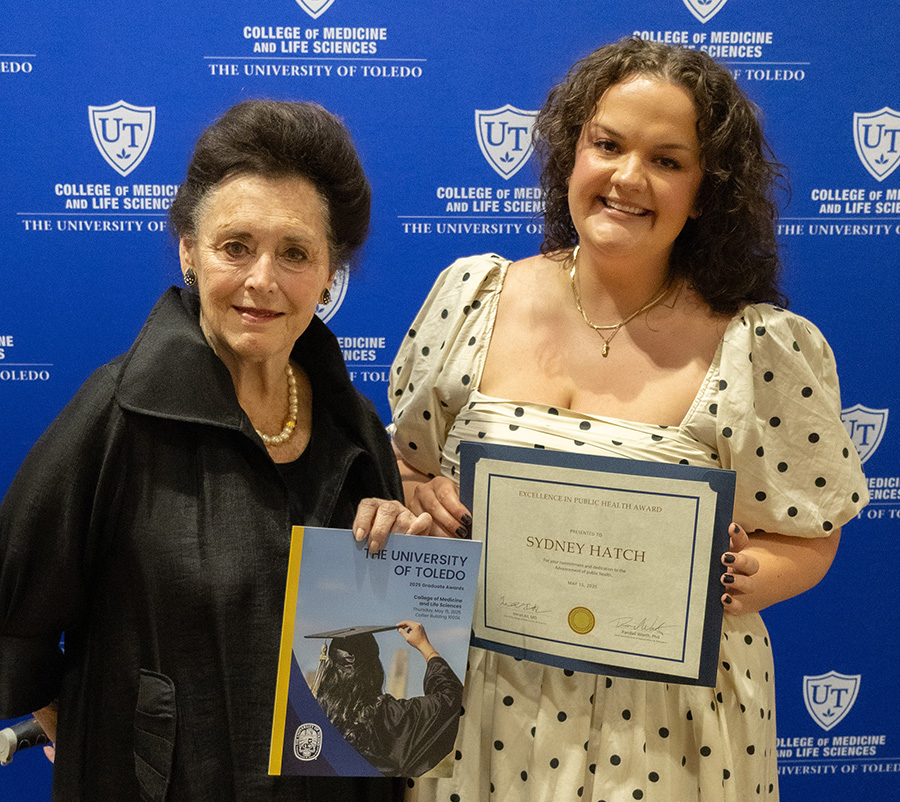 Sydney pictured with her award and Dr. Woodson.