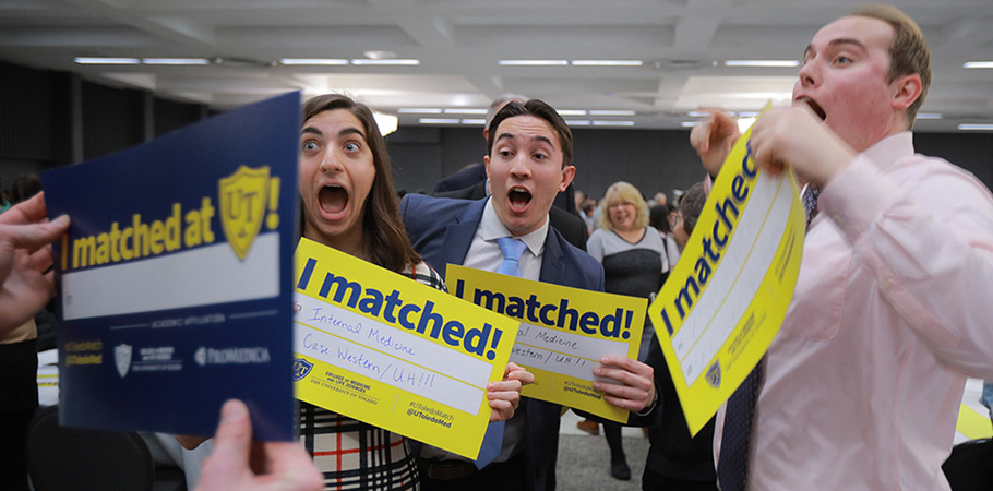 Photo of Match Day 2024 celebrations featuring students with excited faces after a classmate reveals their match location.
