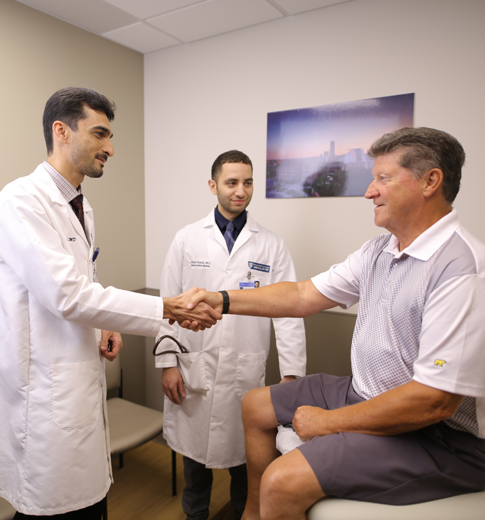 Photo of residents with patient