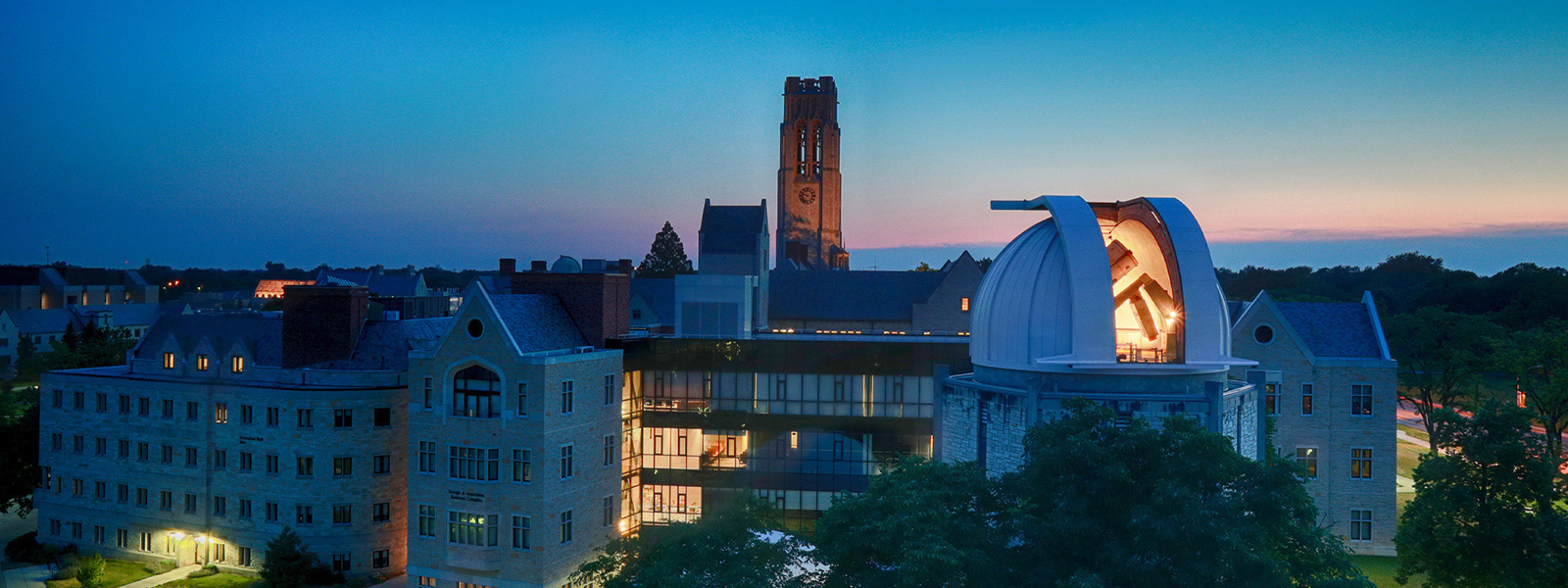 Main Campus at dusk with the University Hall bell tower in the center