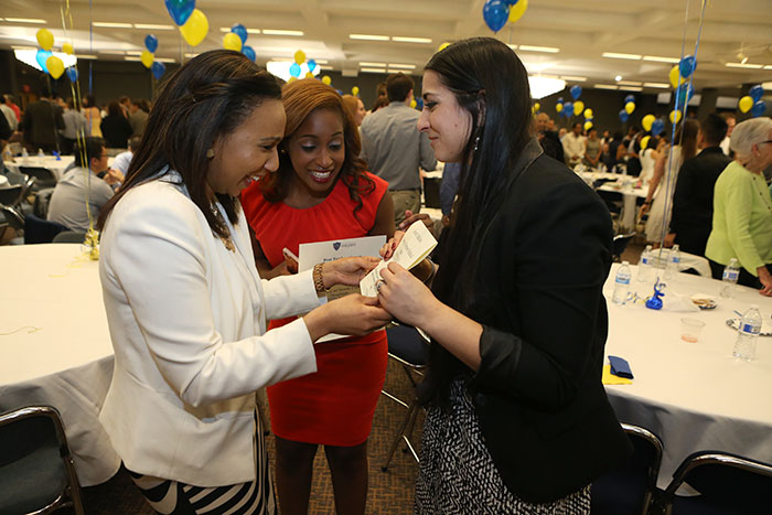 UT Resident Ebtisam Alumin, left, and medical student Tarshree Sawyer, center, are excited to see that Avneet Singh matched in internal medicine at the University of Vermont Medical Center. Sawyer is headed to the University of North Carolina Hospitals for pediatrics.