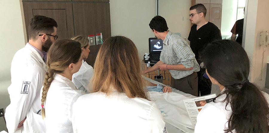 Students in the Simulation Center watch an ultrasound.