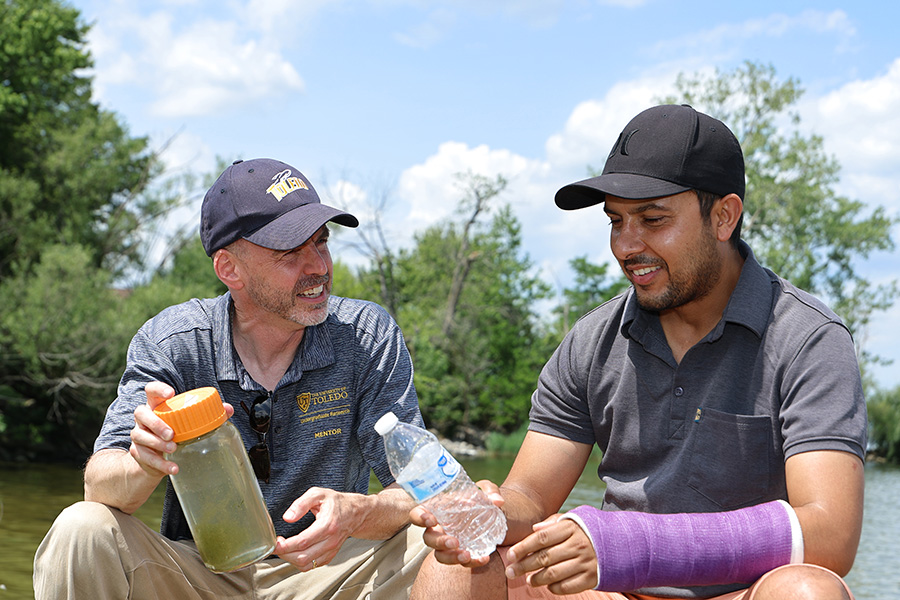 Dr. Kennedy works with a graduate student to examine water quality.