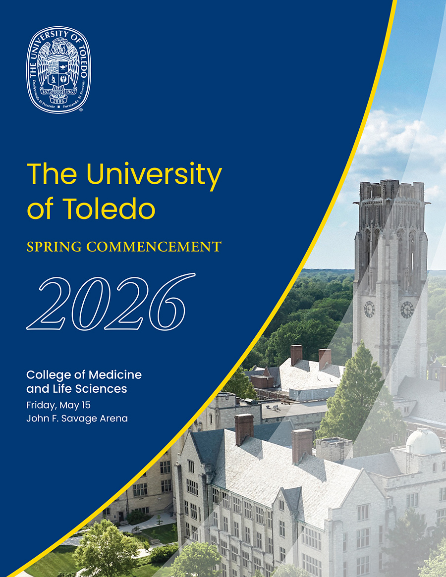 Commencement program cover featuring the University Hall clocktower on main campus in background.