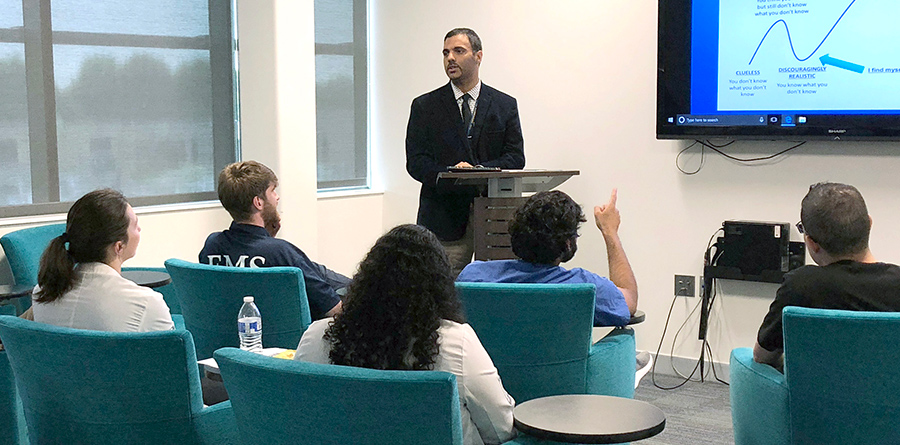 Dr. Moussa in the classroom with students during Bridge Week