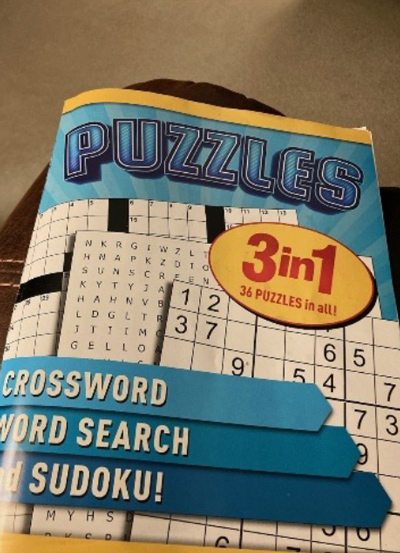 A photo of a book of puzzle, 3 in 1, 36 puzzles in all. Crossword, Word Search and Sudoku.